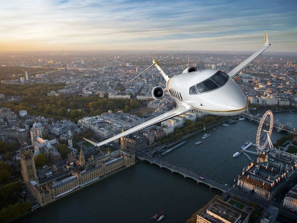 Bombardier Challenger 350 jet with city scape
