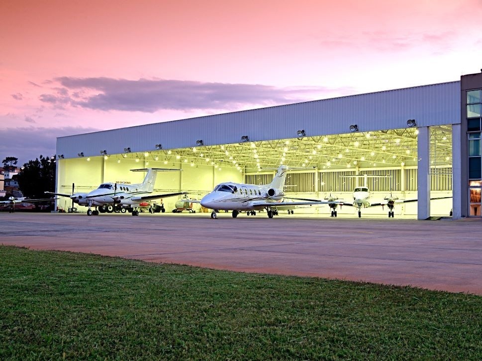 Private Jet and Turboprop Outside Hangar
