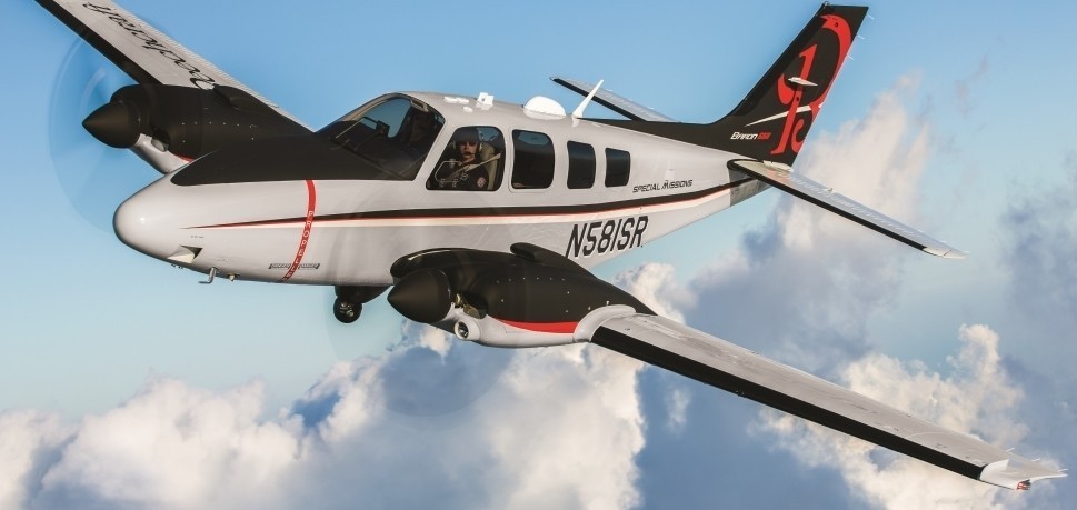 Beechcraft Baron with surveillance camera in flight