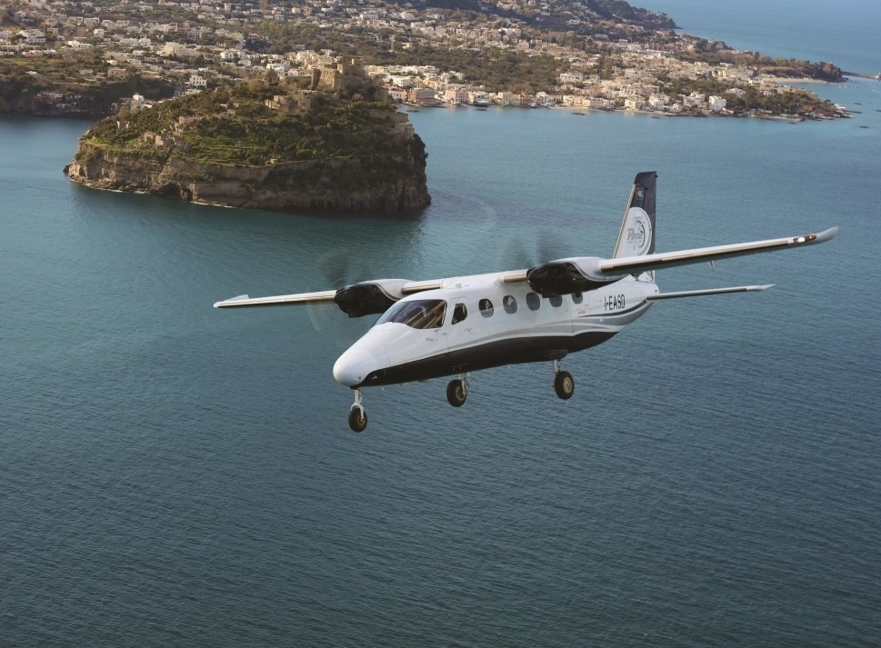 Tecnam P2012 Traveller Flies over Ocean