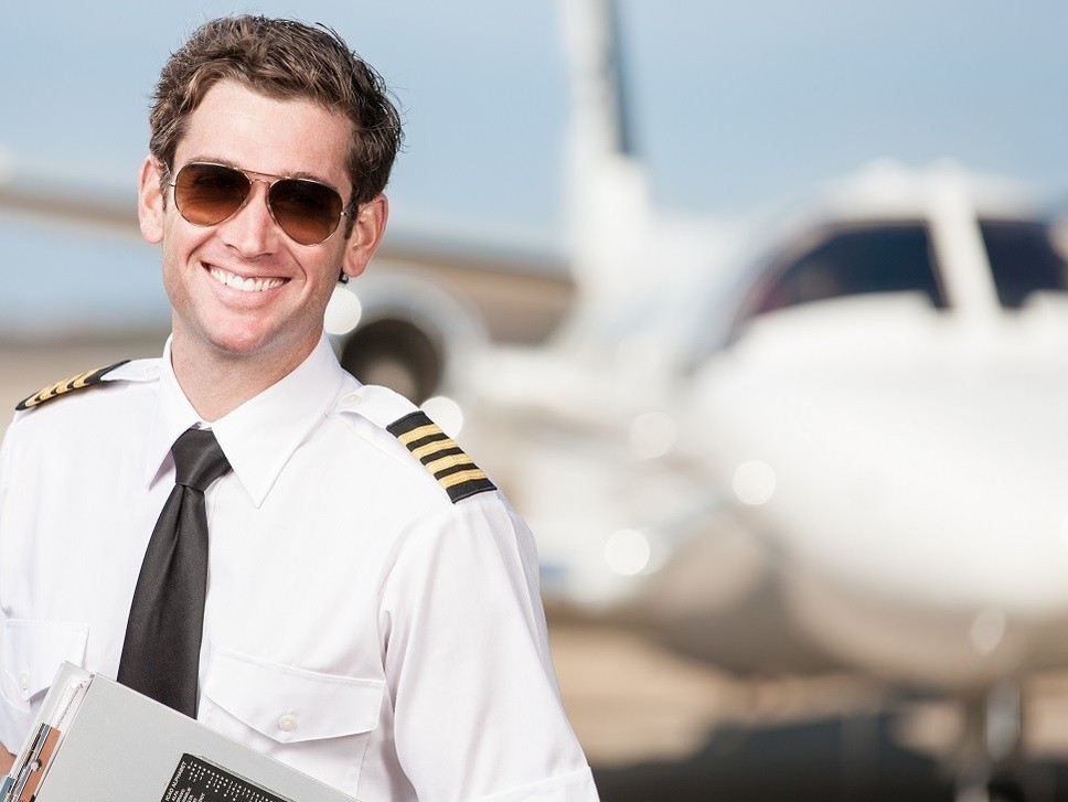 Cessna Citation light jet with pilot standing in front