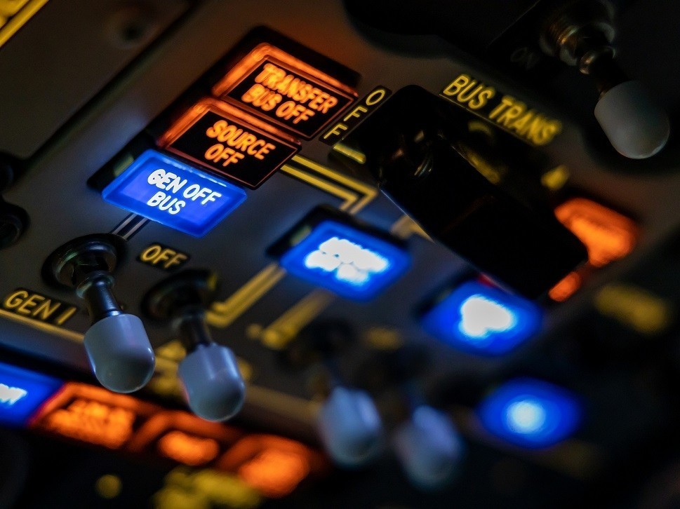 Overhead switches and controls in a private jet cockpit