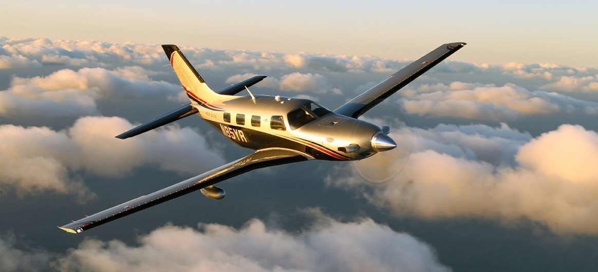 Piper Meridian flying above the clouds