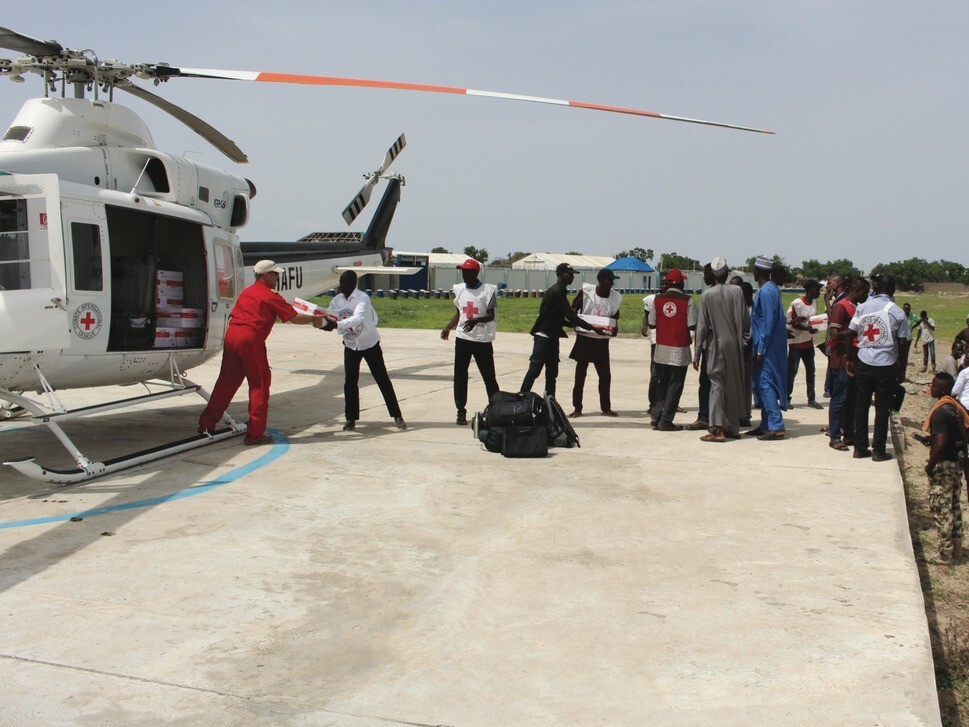 Medical supplies being unloaded off of a Helicopter