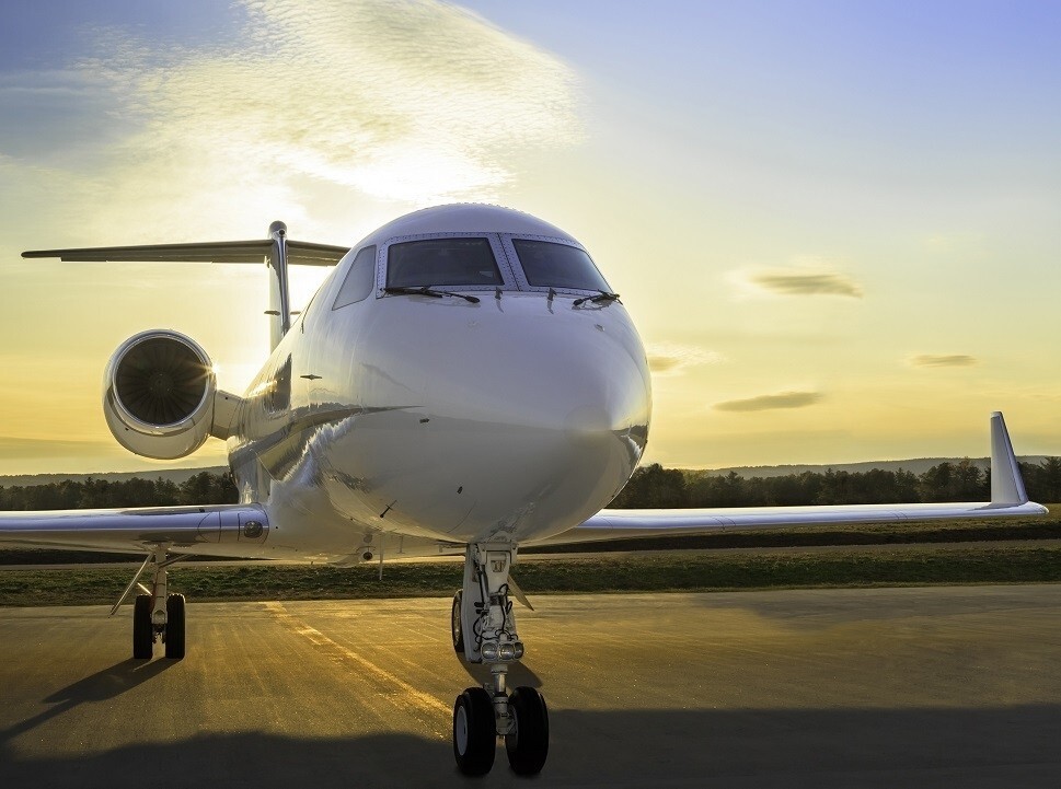 A Gulfstream GIV-SP parked on the airport ramp at sunset