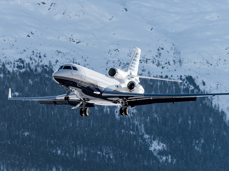 Dassault Falcon jet landing at mountain airport