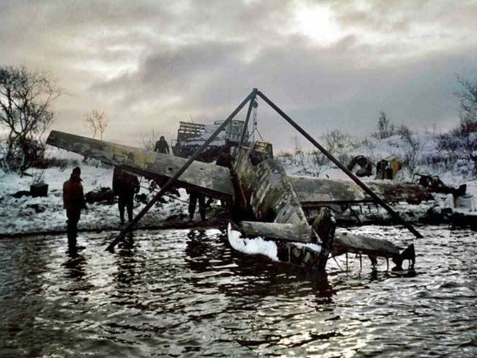 Military aircraft being recovered from lake