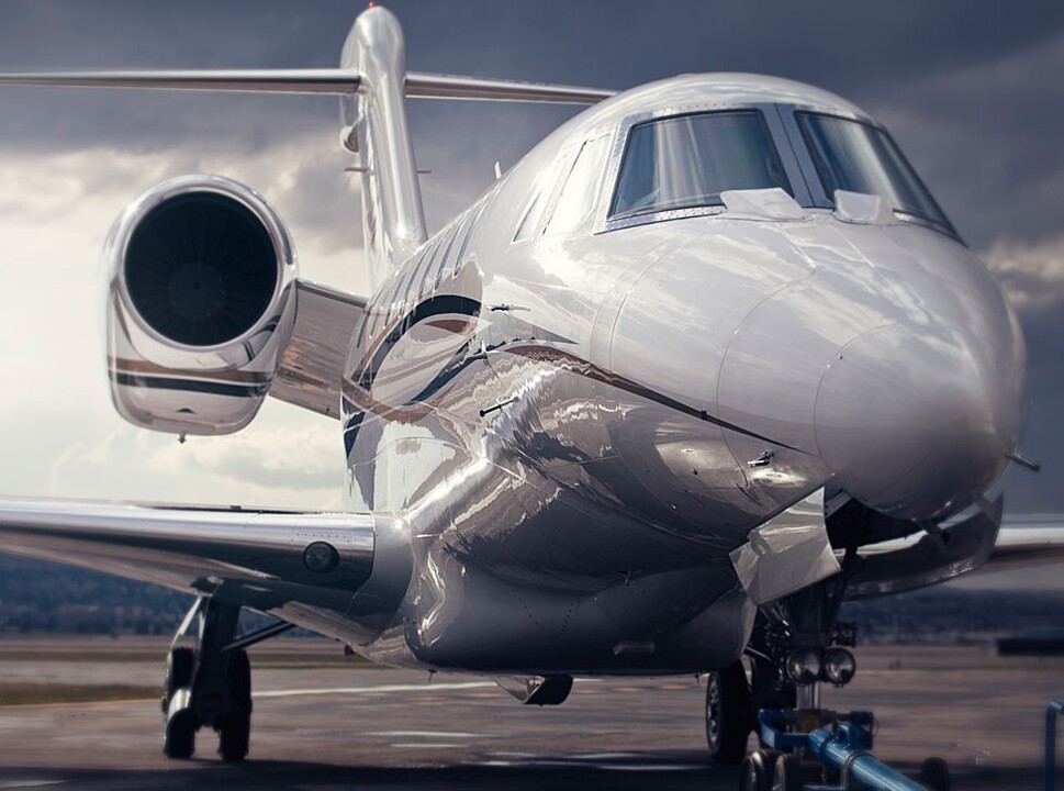 A Cessna Citation X being towed at airport
