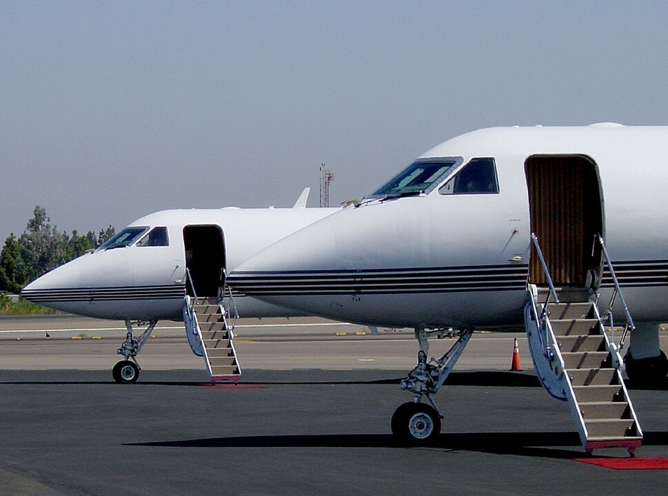 Two private jets in line with airstairs open