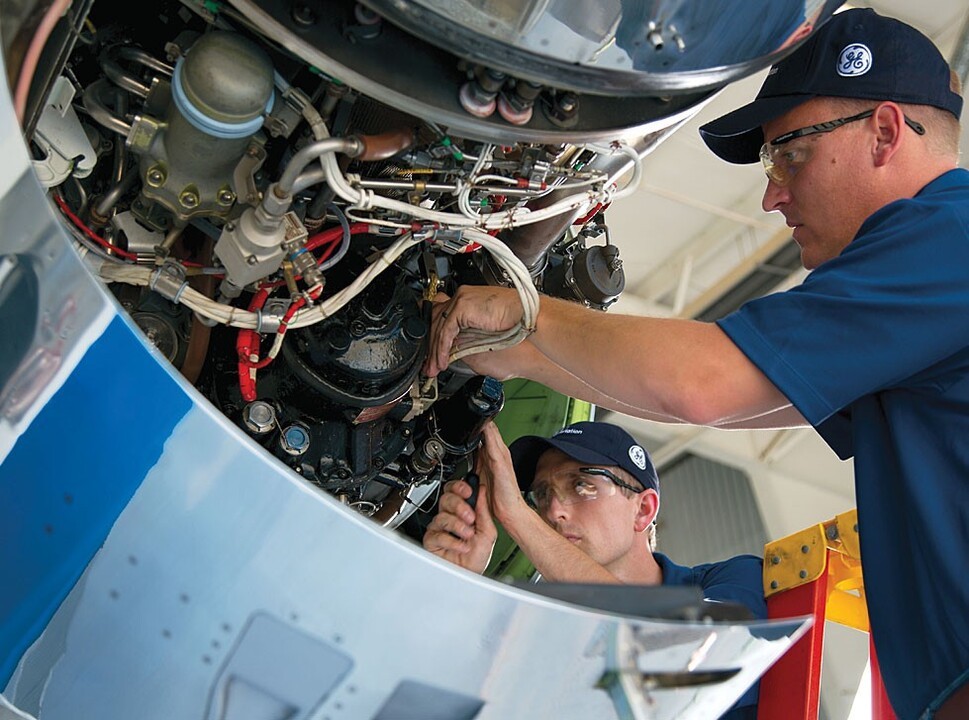 GE Aviation's mechanics inspect a private jet engine