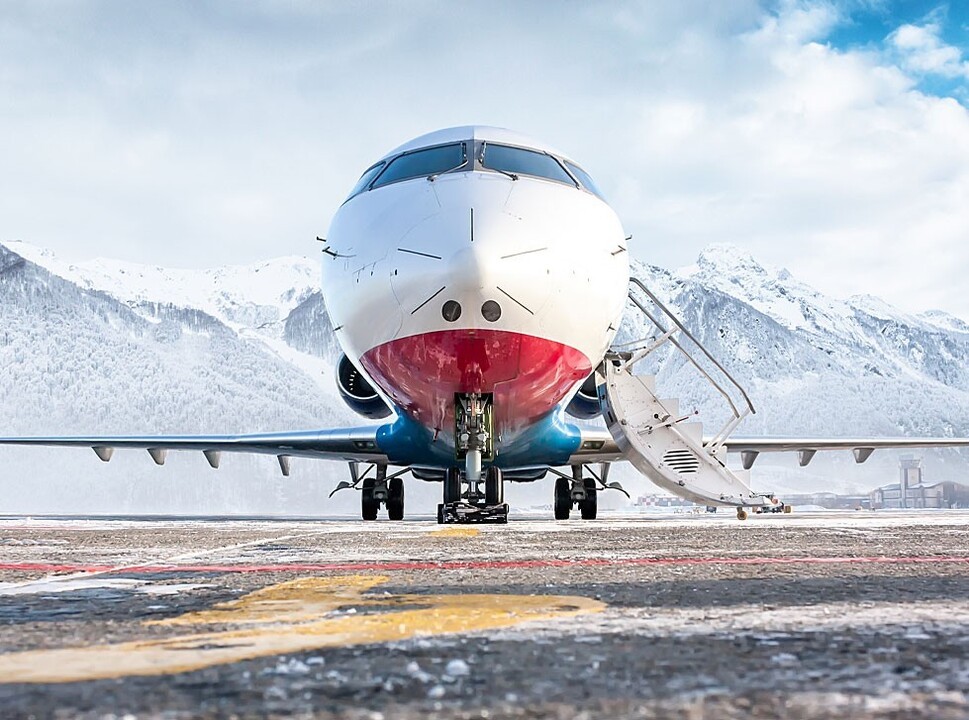 Private jet parked on a frosty airport ramp