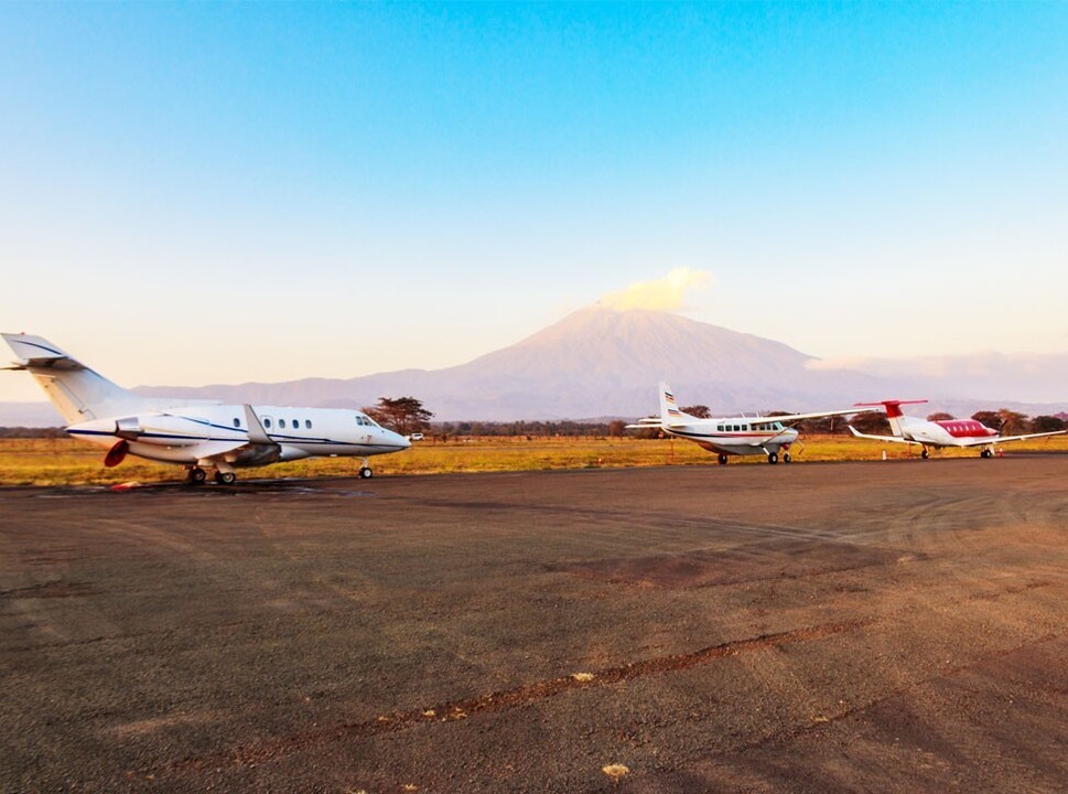 Private jet and turboprops parked at a Tanzanian airport