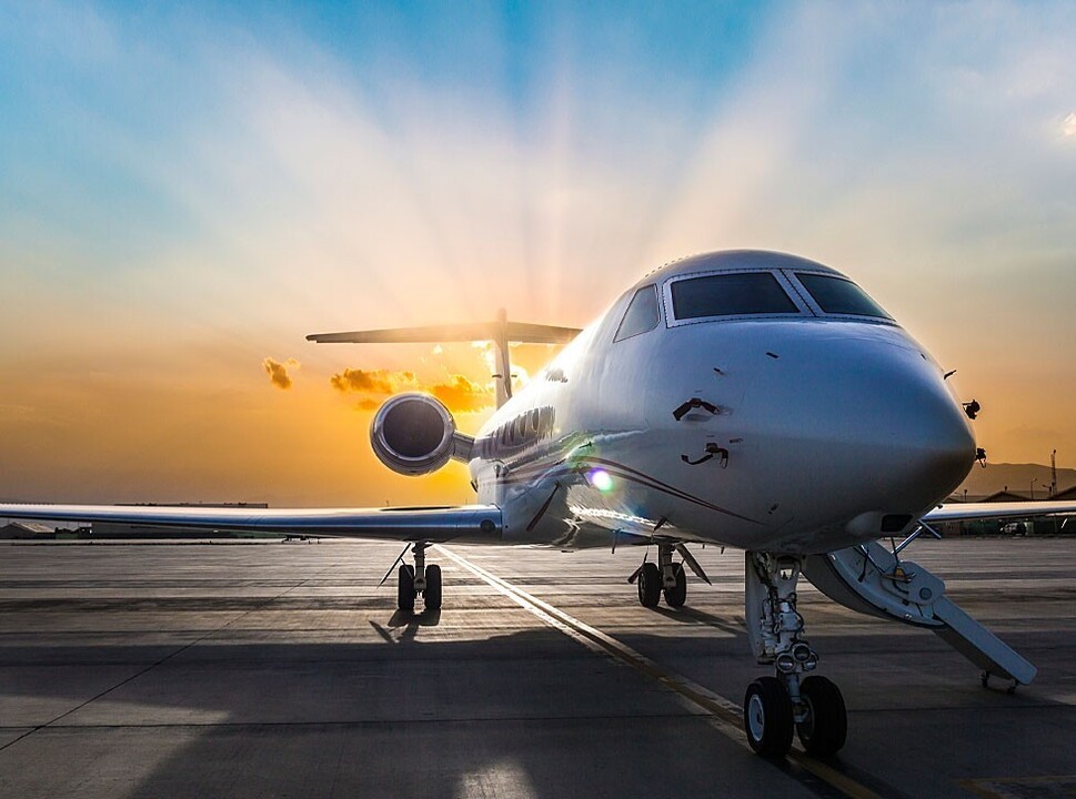 Private Gulfstream Jet with sunrise in the background