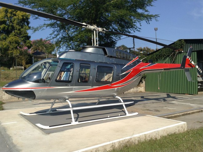 1992 bell 206l3 with champagne silver with burnt orange stripe designs